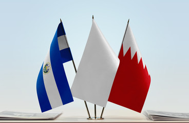 Flags of El Salvador and Bahrain with a white flag in the middle