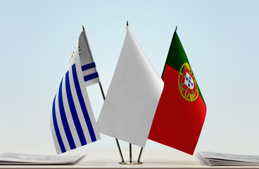 Flags of Uruguay and Portugal with a white flag in the middle