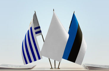 Flags of Uruguay and Estonia with a white flag in the middle