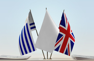 Flags of Uruguay and United Kingdom with a white flag in the middle