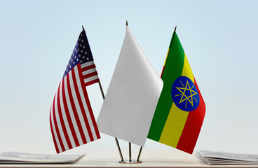 Flags of USA and Ethiopia with a white flag in the middle