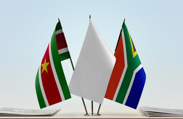 Flags of Suriname and Republic of South Africa with a white flag in the middle