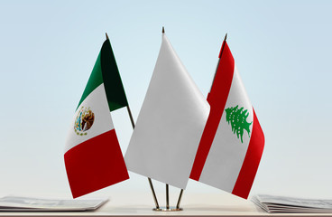 Flags of Mexico and Lebanon with a white flag in the middle
