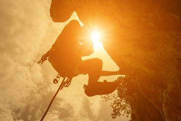silhouette of mountain climber at riley beach, Krabi, Thailand