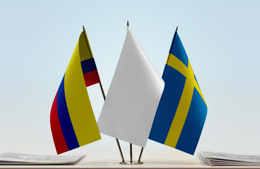 Flags of Colombia and Sweden with a white flag in the middle