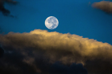 Naklejka na ściany i meble Photo of the full moon over the Rocky Mountains in Colorado