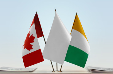 Flags of Canada and Ivory Coast with a white flag in the middle