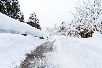 car tire track on snow in the winter road