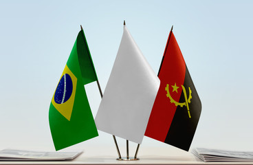 Flags of Brazil and Angola with a white flag in the middle