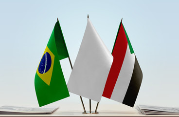 Flags of Brazil and Sudan with a white flag in the middle