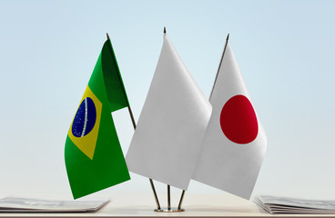 Fototapeta na wymiar Flags of Brazil and Japan with a white flag in the middle
