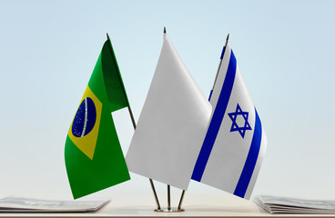 Flags of Brazil and Israel with a white flag in the middle