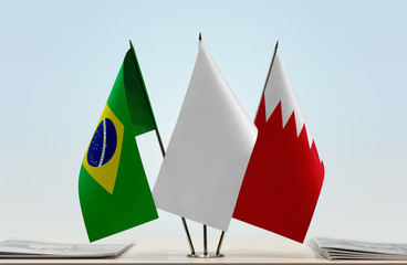 Flags of Brazil and Bahrain with a white flag in the middle