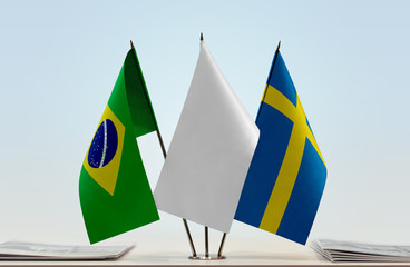 Flags of Brazil and Sweden with a white flag in the middle