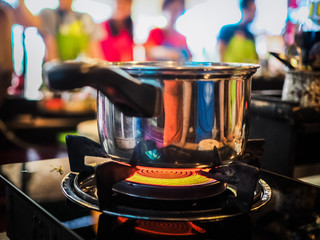 closeup of a pot on gas stove during a thai cooking class