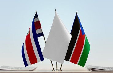 Flags of Costa Rica and South Sudan with a white flag in the middle