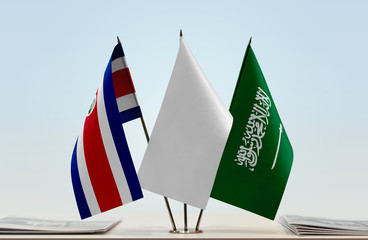 Flags of Costa Rica and Saudi Arabia with a white flag in the middle