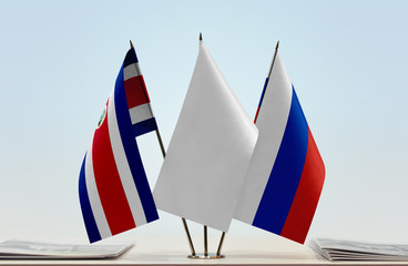 Flags of Costa Rica and Russia with a white flag in the middle