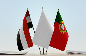 Flags of Yemen and Portugal with a white flag in the middle