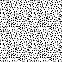 Seamless background with random black circles. Abstract ornament. Dotted abstract pattern