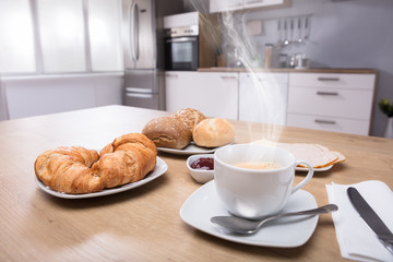 Close-up Of Croissants And Cup Of Coffee