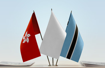 Flags of Hong Kong and Botswana with a white flag in the middle