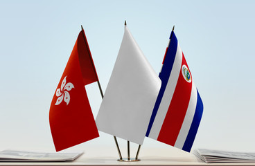 Flags of Hong Kong and Costa Rica with a white flag in the middle