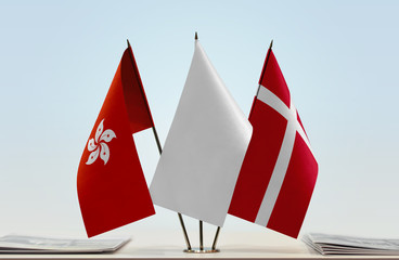 Flags of Hong Kong and Denmark with a white flag in the middle
