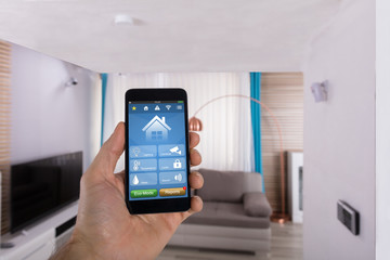 Human Hand Using Smart Home System On Smartphone