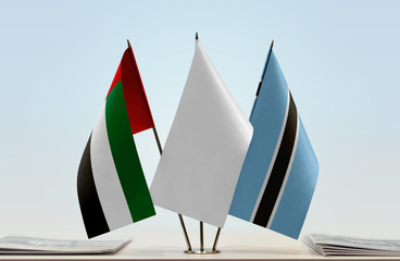 Flags of UAE and Botswana with a white flag in the middle