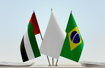 Flags of UAE and Brazil with a white flag in the middle