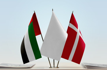 Flags of UAE and Denmark with a white flag in the middle