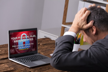 Looking At Laptop Screen Showing Personal Files Encrypted Text