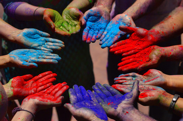 Color powder on hands during holi festival near Pune