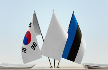 Flags of South Korea and Estonia with a white flag in the middle