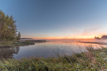 Naklejka na ściany i meble Morning mist on lake Vanaja, Finland