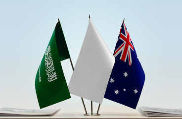 Flags of Saudi Arabia and Australia with a white flag in the middle