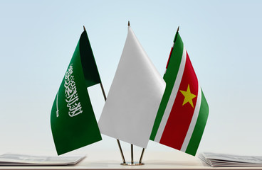 Flags of Saudi Arabia and Suriname with a white flag in the middle