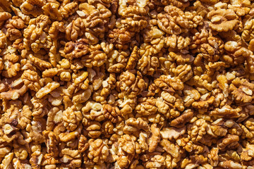 Peeled walnuts under the bright sun.