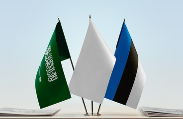 Flags of Saudi Arabia and Estonia with a white flag in the middle