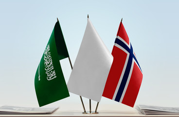 Flags of Saudi Arabia and Norway with a white flag in the middle