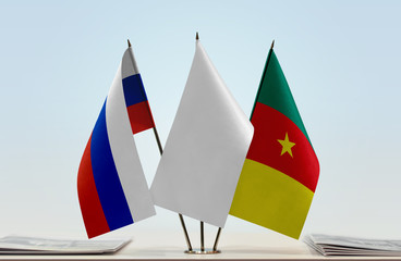 Flags of Russia and Cameroon with a white flag in the middle