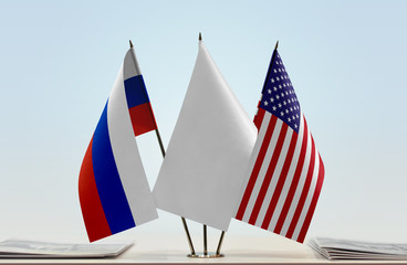 Flags of Russia and USA with a white flag in the middle