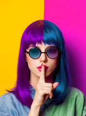 Young girl with purple hair and sunglasses