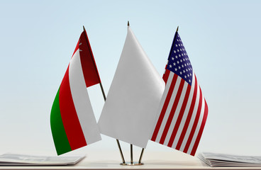 Flags of Oman and USA with a white flag in the middle