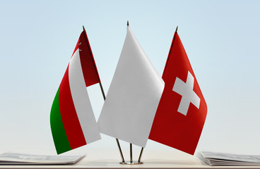 Flags of Oman and Switzerland with a white flag in the middle