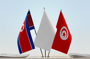 Flags of North Korea and Tunisia with a white flag in the middle