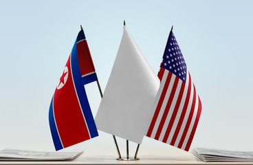 Flags of North Korea and USA with a white flag in the middle