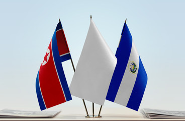 Flags of North Korea and El Salvador with a white flag in the middle