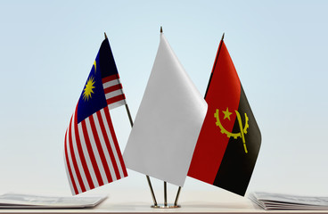 Flags of Malaysia and Angola with a white flag in the middle